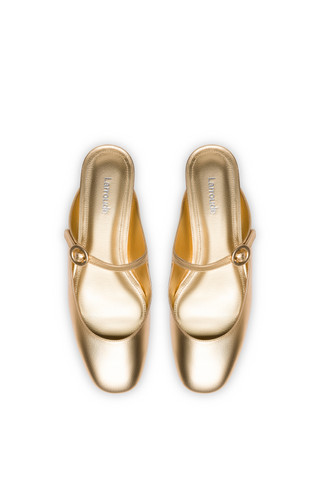 Blair Flat Mule In Gold Metallic Leather